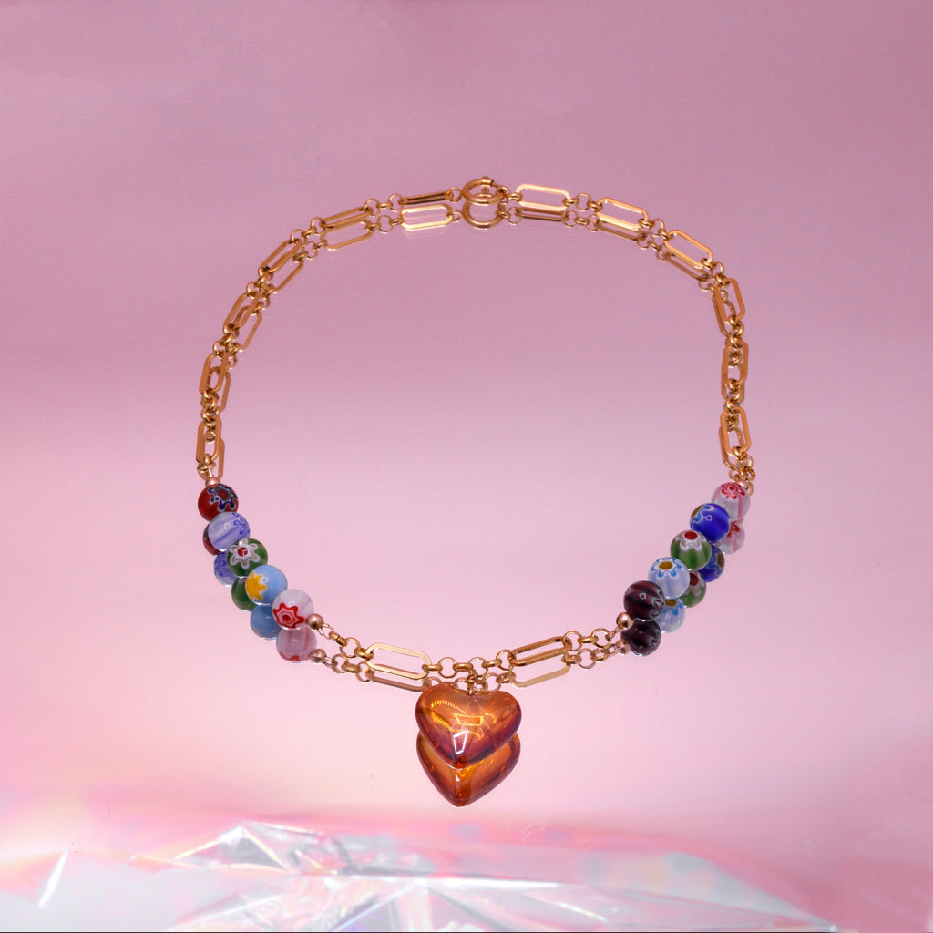 Stainless steel ketting met millefiori kralen en oranje puffy hart 